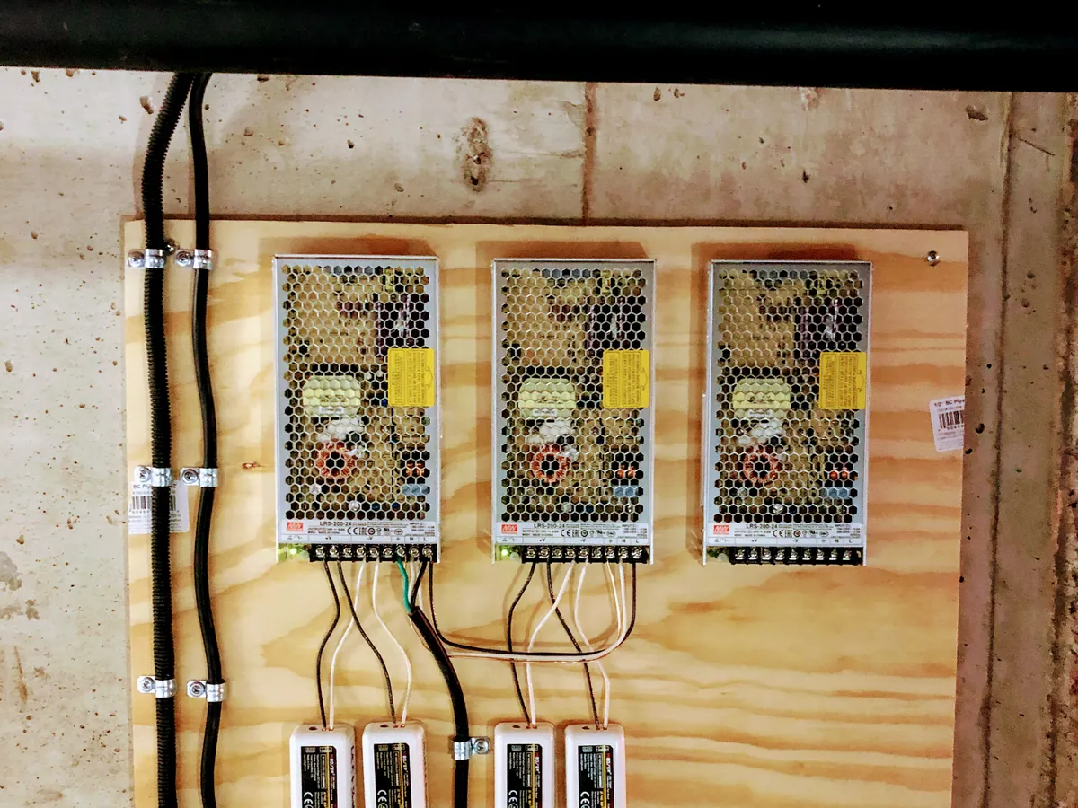 Three LED drivers and wiring mounted on a plywood board