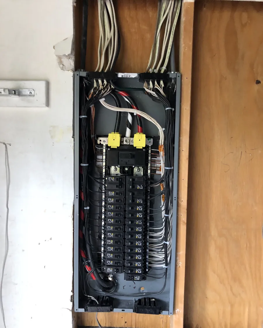 Breaker panel between wall studs during construction